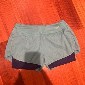 Blue Nike dry fit running shorts (size small)